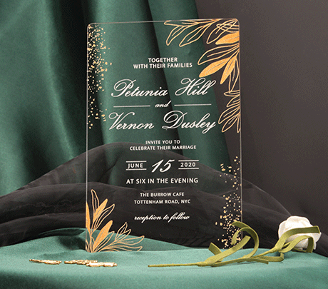Transparent acrylic wedding invitation with gold writing
