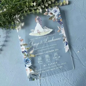 Matte frosted acrylic wedding invitation HPI309 featuring a whimsical UV-printed cartoon wedding couple, rabbit, and cat inside a clear transparent sleeve