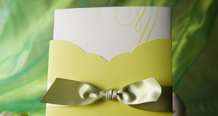 yellow pocket fold wedding invitation suite with printed insert card and elegant ribbon closure