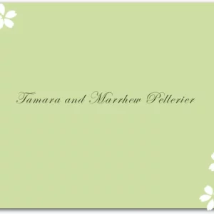 A soft green thank you card with delicate floral accents and a minimalist botanical design.